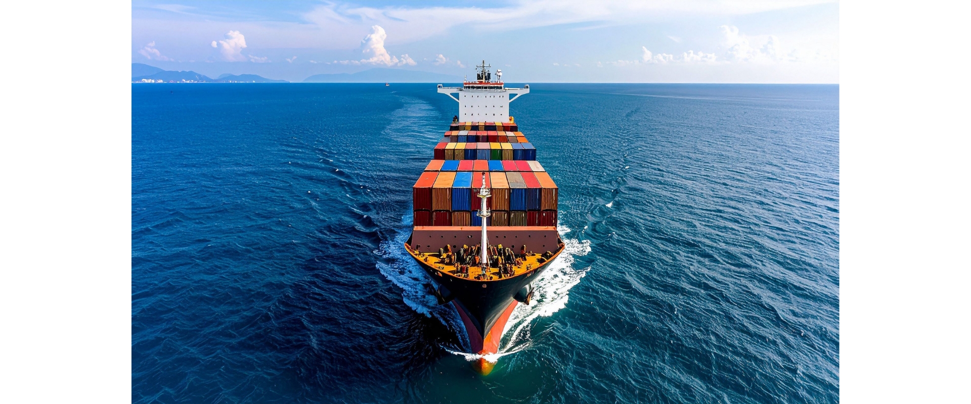 Aerial view of container ship on blue ocean